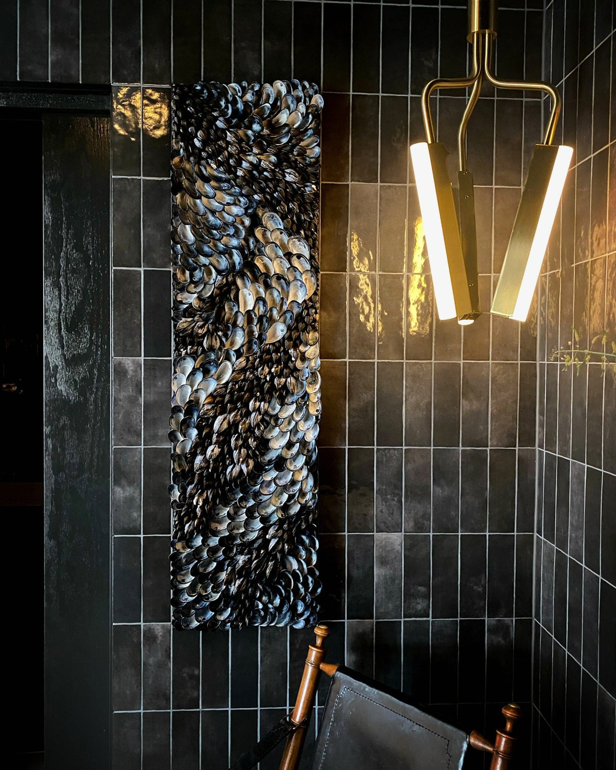Blue Flow mounted in the black vestibule, five tiles wide and six high
