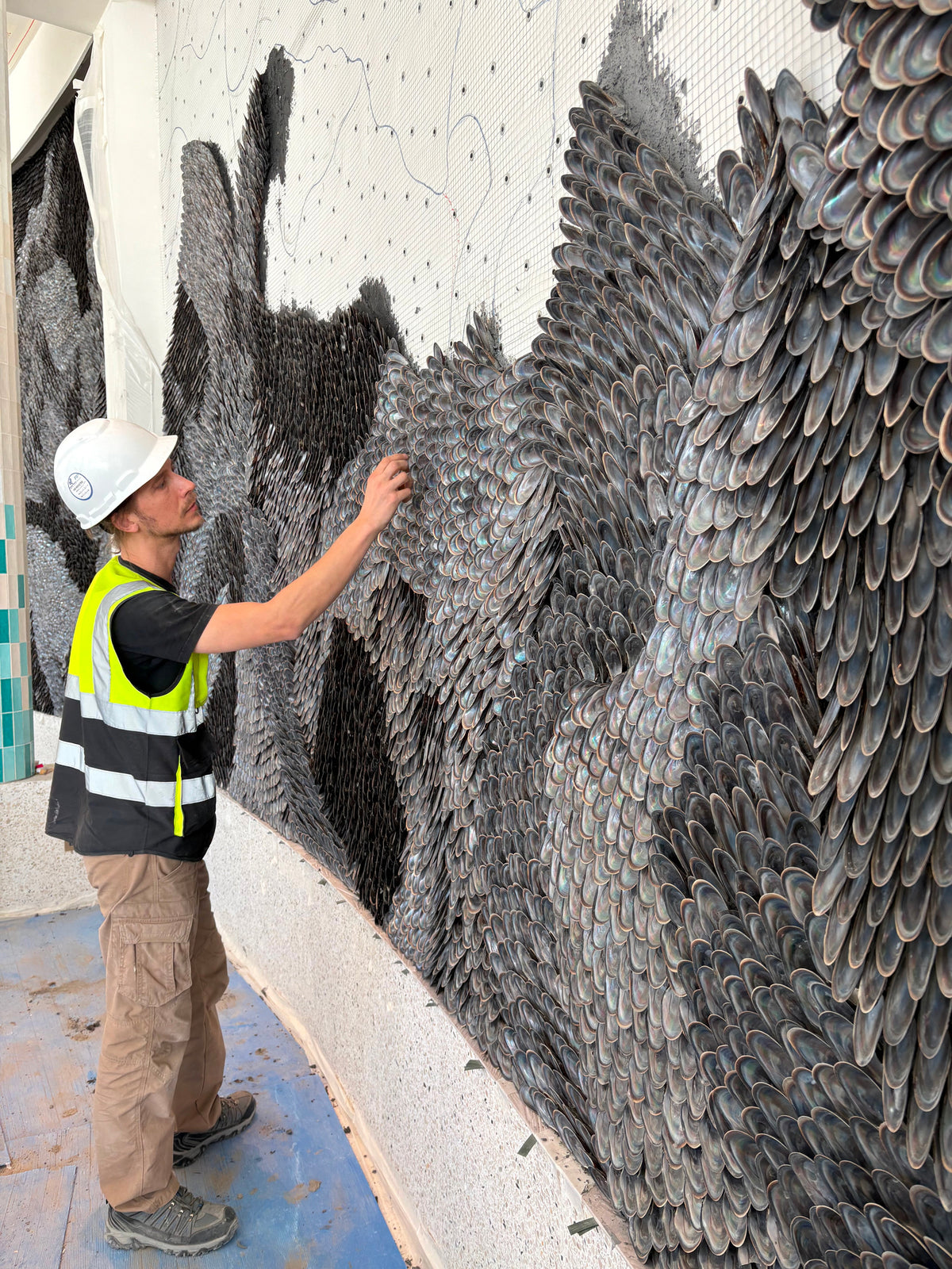 Buster Eriksson inspecting the shell wall from floor level