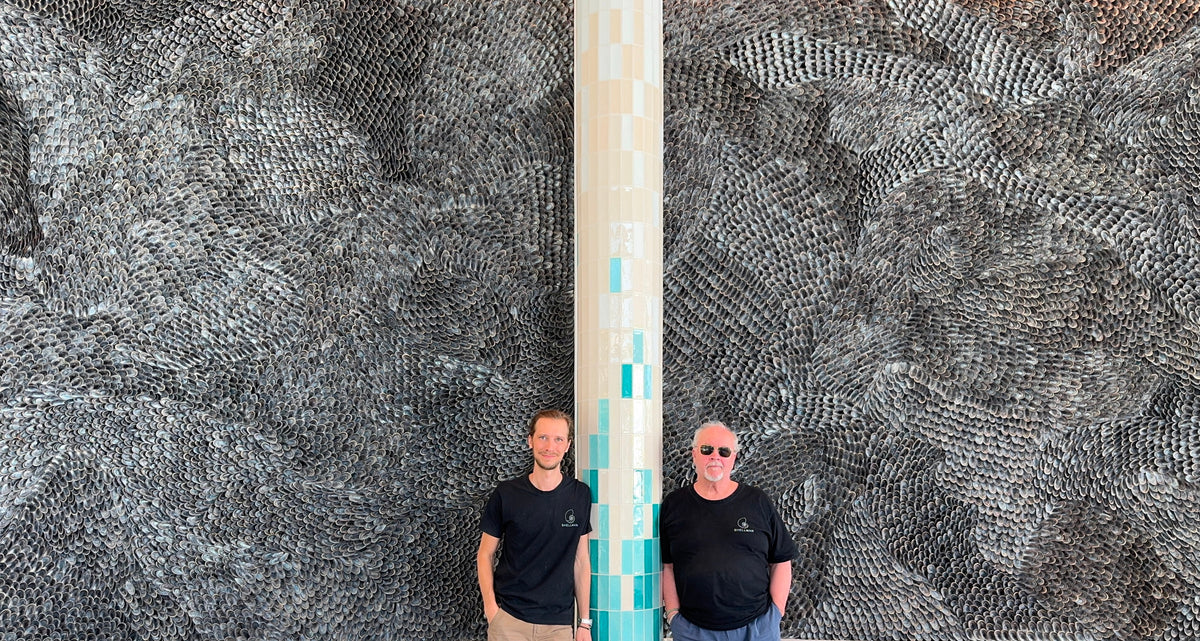 Buster Eriksson and Mikael Hjärtsjö standing in front of the finished Fields of Mytilus wall