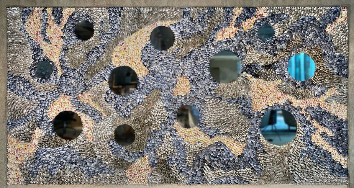 The Flow, a shell art wall of blue mussels, cockles and abalone around eleven round mirrors at Platinan, Gothenburg